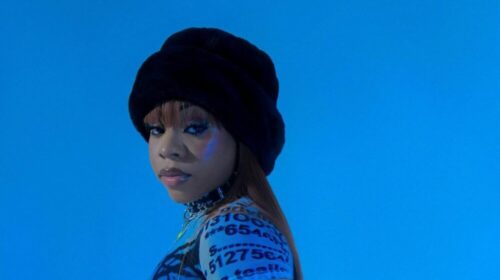 A woman wearing a hat and blue shirt in an artwork for the video "belong to you" by fave.