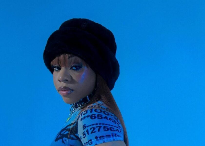 FAVE – Belong To You (Official Video) A woman wearing a hat and blue shirt in an artwork for the video "belong to you" by fave.