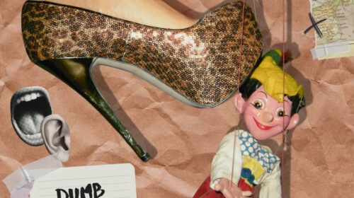 A woman holds a shoe with a man's foot on it. The image is related to the song 'Dumb lovesong' by Arabella.