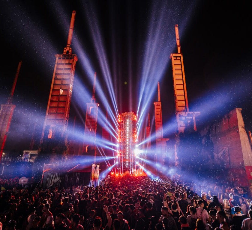 Kappa FuturFestival 2024 Stage Splits & After Parties A lively crowd at Kappa Futurfestival, illuminated by bright lights