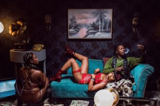 Artwork for As E Dey Go music video by Naira Marley