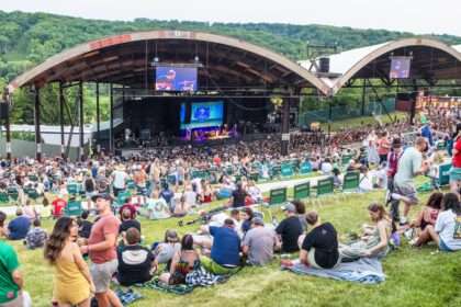 Crowd on a hill in front of a stage