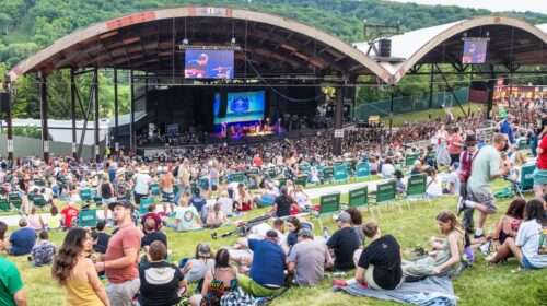 Crowd on a hill in front of a stage