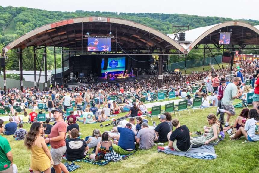 Crowd on a hill in front of a stage