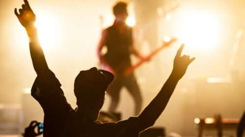 photo from the crowd of a musician on stage